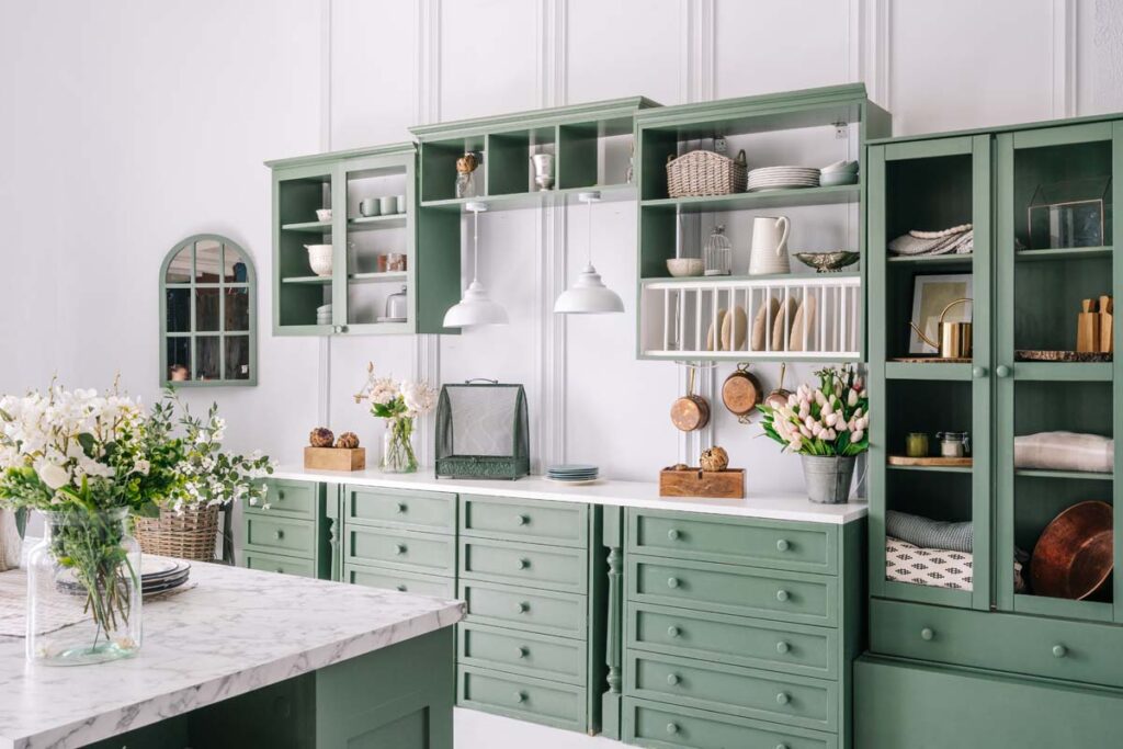 New stylish white kitchen with green furniture